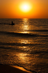Beautiful seascape with orange warm sunrise