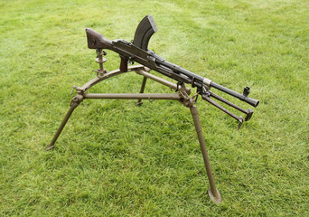 A Vintage Military Machine Gun on a Tripod Stand.