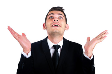 Happy businessman looking up