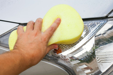 The washing of car by a sponge