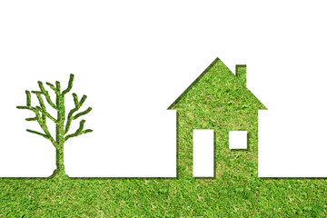 Conceptual house symbol of grass with green tree