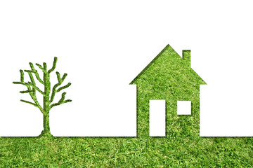 Conceptual house symbol of grass with green tree