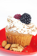 muffin with whipped cream,mint, raspberries, blackberries and nu