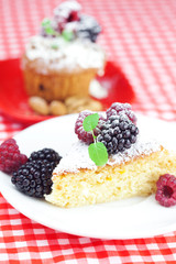 muffin with whipped cream, cake with icing, raspberry, blackberr