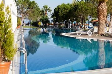 Fototapeta na wymiar Swimming pool at the modern luxury hotel