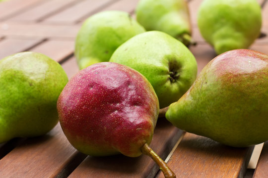 Fresh sweet organic  pears on wooden surface
