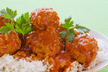 Meatballs with rice in tomato sauce