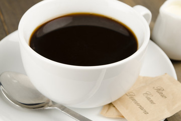 Americano black coffee, demerara sugar sachets & a jug of milk