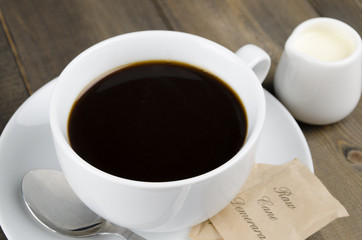 Americano black coffee, demerara sugar sachets & a jug of milk