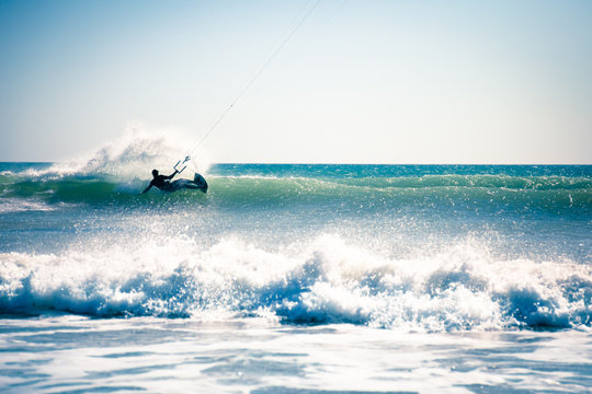 Kite surfing in waves.