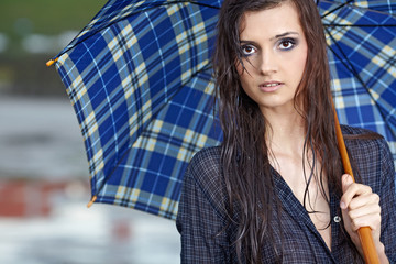 woman  on street after rain