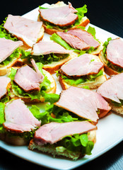 Closeup of delicious ham and salad canapes