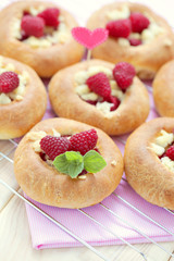 buns with raspberries
