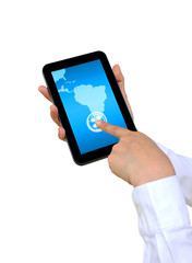 hand pushing South America Continent on a touch screen