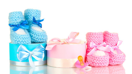 baby boots, pacifier, gifts and blank postcard  isolated