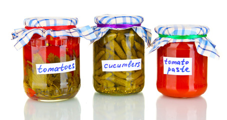 Jars with canned vegetables isolated on white