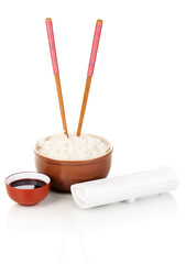 Bowl of rice and chopsticks isoalted on white