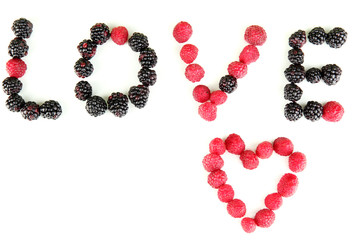 Word Lowe of raspberries and brambles close-up isolated on