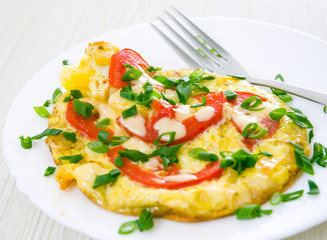 Omelet with tomatoes and green onions