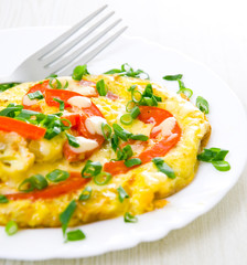 Omelet with tomatoes and green onions
