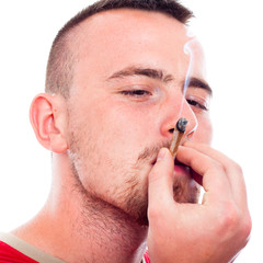 Young man smoking hashish
