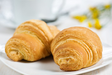 Croissants with cup of tea