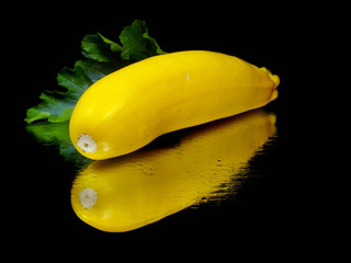 yellow zucchini with leaf - obrazy, fototapety, plakaty