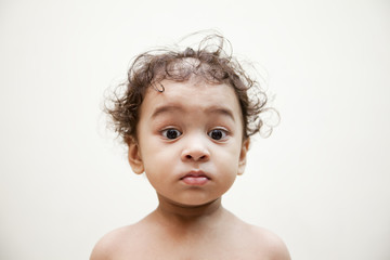 Indian baby looking and think