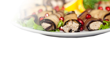 aubergines with salad leaves isolated over white background

