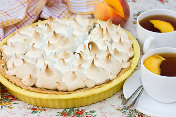 A delicious cake with peaches and meringue
