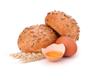 Bun with seeds and broken egg