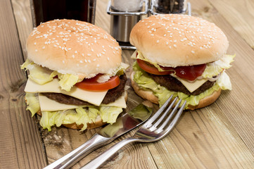 Two Cheeseburger on wooden background