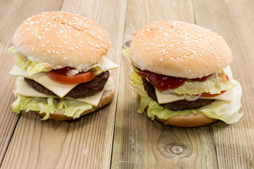 Two Cheeseburger on wooden background