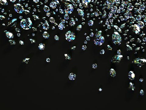 a variety of diamonds scattered on black surface