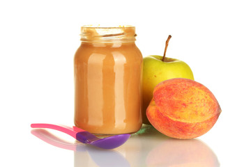 Jar with fruit baby food and spoon isolated on white