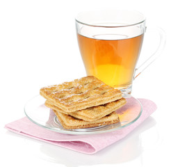 Cup of tea and cookies isolated on white