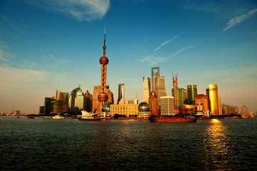 Naklejka premium Modern China - Shanghai skyline at sunset