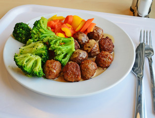 plate with meatballs carrots cabbage