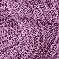 close up purple knitted pullover background