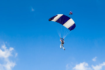 Two colour parachute over the clear sky