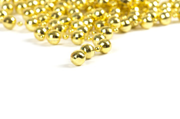 Background made of a brilliant celebratory beads of golden color