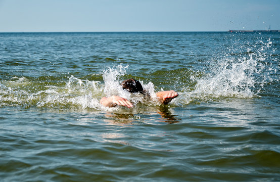 Young Male Swimming In The Sea/ocean