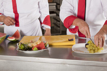 Two chefs at work in a restaurant