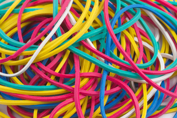Colourful elastic bands on white background close up