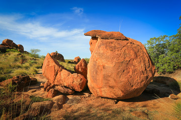 Granite eroded red rock formation, big stone pebbles geology by
