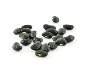 A small handful of black beans - preto. Beans isolated on a whit