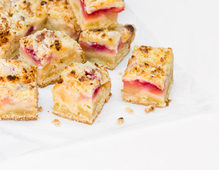 Slices of apple pie on a white background