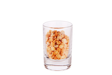 Shot glass filled with peas