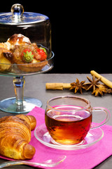 red tea cup with confectionery