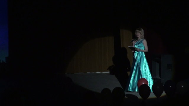 The actress on the stage in a beam of light
